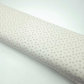 Baumwolljersey Stoff – kleine Fußspuren auf Creme