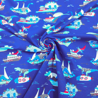 Baumwolljersey Stoff – Dino‑Boote Königsblau