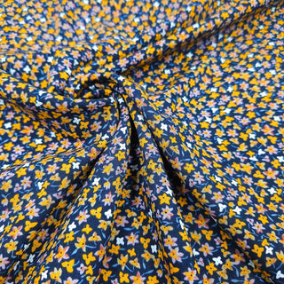 Viskose Stoff – Senfgelbe Streublümchen auf Dunkelblau