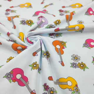 Baumwolljersey Stoff – Blumige Gitarren