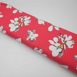Viskosejersey Stoff – Weisse Blumen auf Korallpink