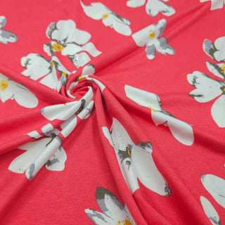 Viskosejersey Stoff – Weisse Blumen auf Korallpink