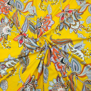 Viskosejersey Stoff – Paisley‑Blüten auf Sonnengelb