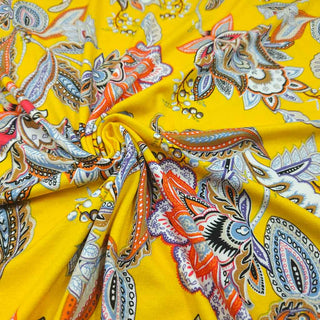 Viskosejersey Stoff – Paisley‑Blüten auf Sonnengelb