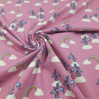 Detailaufnahme Bio Baumwolljersey – elastischer Jersey Stoff mit Regenbogen und Blumen Print