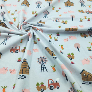 Detailaufnahme Jersey Stoff – Bauernhof Print mit Traktor und Tieren