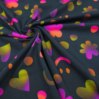 Baumwolljersey Stoff – Smiley, Herzen & Blumen auf Schwarz