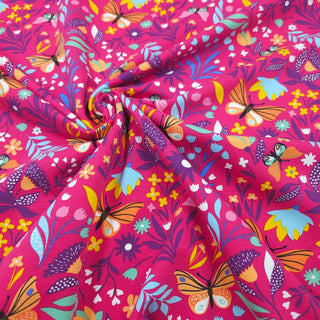 French Terry Stoff – Blumenwiese mit Schmetterlingen auf Pink