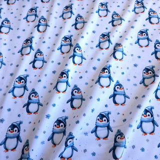 Baumwolljersey Stoff – Winterpinguine auf Weiß