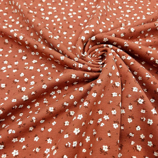 Baumwolljersey Stoff – Streublümchen in Terracotta