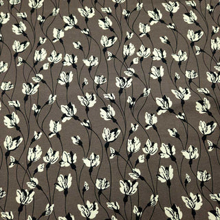 Baumwolljersey Stoff – Wollweisse Blüten auf Taupe
