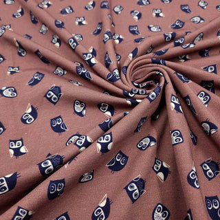 Baumwolljersey mit Eulen in Nachtblau auf Mauve als Meterware