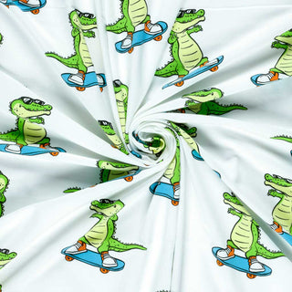 Baumwolljersey Stoff – Krokodil auf Skateboard