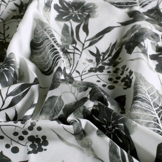 Baumwolljersey Stoff mit botanischen Blättern in Schwarz und Weiss