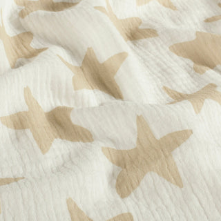 Musselin Stoff – Grosse Sterne in Sand auf Wollweiss