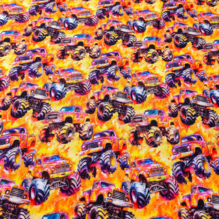 Sweat Stoff - Gelb-Orange mit Monster-Trucks