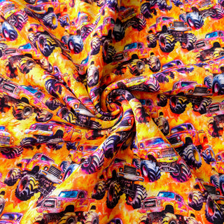 Sweat Stoff - Gelb-Orange mit Monster-Trucks