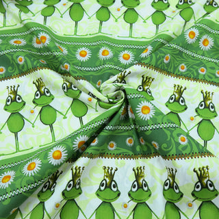 Grüner Baumwollstoff mit Froschkönig- und Gänseblümchen-Motiv – 100 % Baumwolle, ideal für Kinderkleidung, Deko & Accessoires – erhältlich bei Stoffrestposten.ch