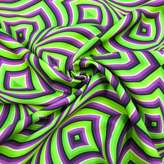 Burlington Stoff – Geometrisches Muster in Grün & Lila