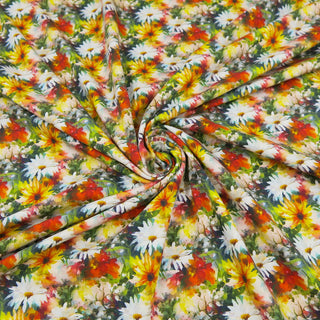 Jersey Stoff mit buntem Sommerblumen-Druck in Gelb, Rot, Weiß und Grün – elastischer Baumwolljersey für Kleidung und Accessoires, erhältlich bei Stoffrestposten.