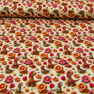 Jersey Stoff 3D Digitaldruck – gestrickte Dinosaurier mit bunten Blumen in Orange, Pink und Grün, ideal für Kinderkleidung von Stoffrestposten
