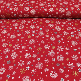 Baumwolle - Schneeflocken und Sterne auf Rot Stoffrestposten
