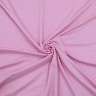 Dehnbarer rosa Jersey-Stoff aus Viskose mit Elasthan – weich fallender Stoff für Shirts, Kleider und Leggings – jetzt bei Stoffrestposten erhältlich