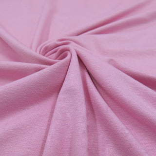 Dehnbarer rosa Jersey-Stoff aus Viskose mit Elasthan – weich fallender Stoff für Shirts, Kleider und Leggings – jetzt bei Stoffrestposten erhältlich