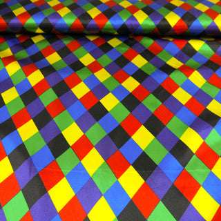 Satin Stoff Harlekin – Bunt & glänzend auf Schwarz