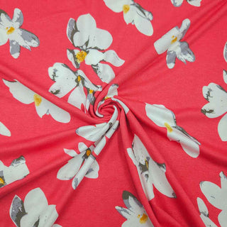Viskosejersey Stoff – Weisse Blumen auf Korallpink