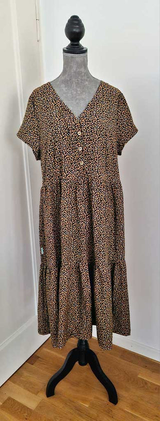 Viskose Stoff – Senfgelbe Streublümchen auf Dunkelblau