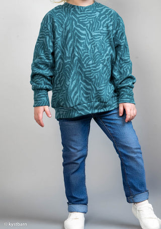 Jacquard Jersey Stoff – Zebramuster in Rauchblau auf Petrol