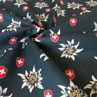 Beschichtete Baumwolle - Edelweiss und Schweizer Wappen auf Dunkelgrün